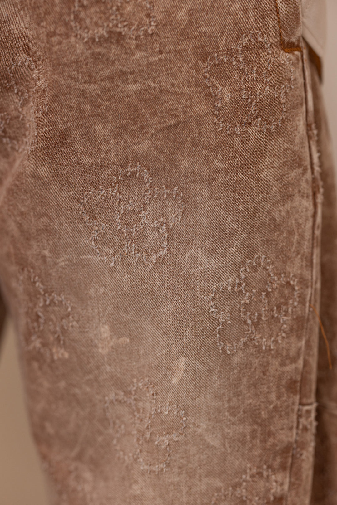 Women's washed almond tan twill barrel pants Easel showing distressed floral print