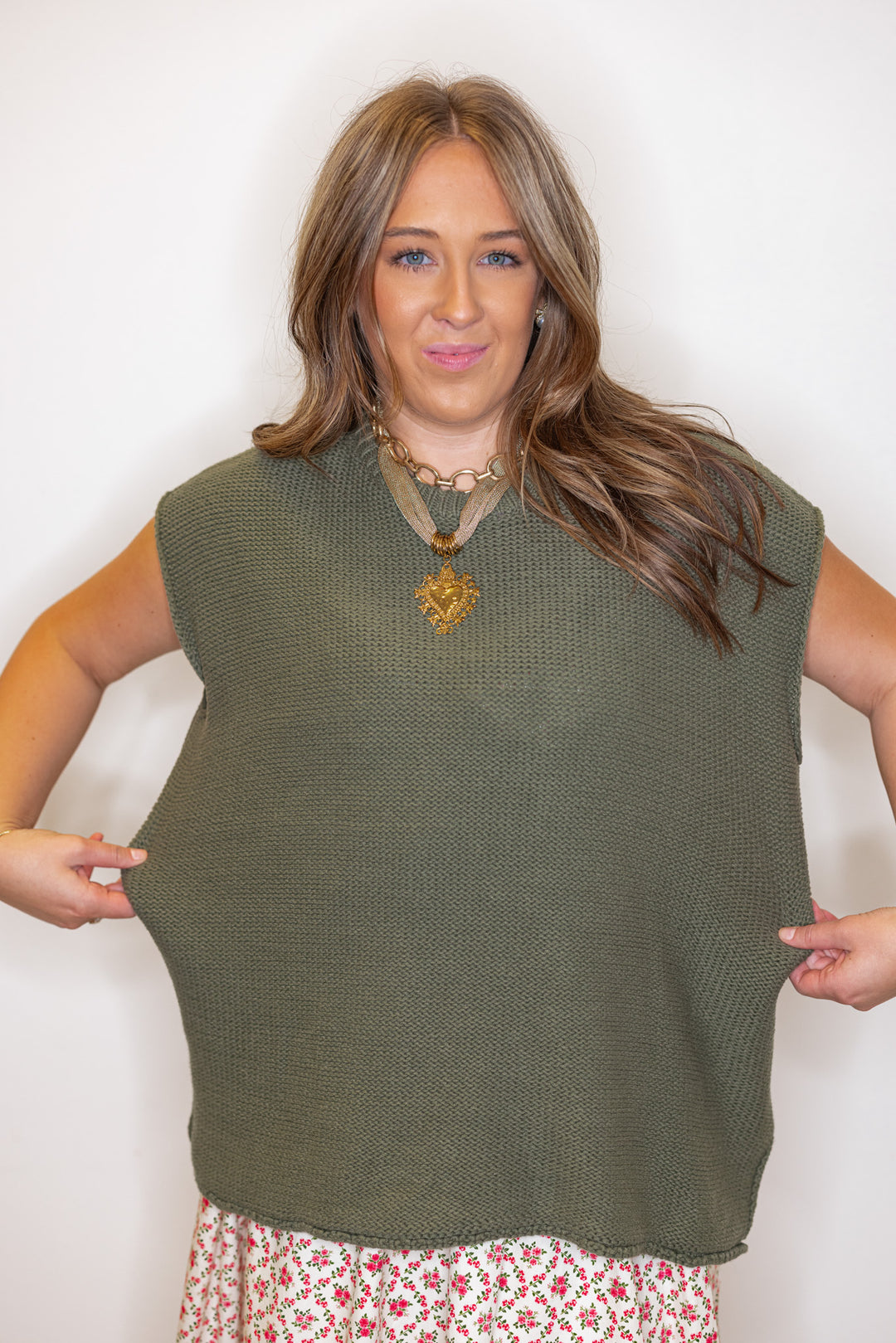 Women's olive green short sleeve sweater knit top by Wishlist showing slightly oversized fit
