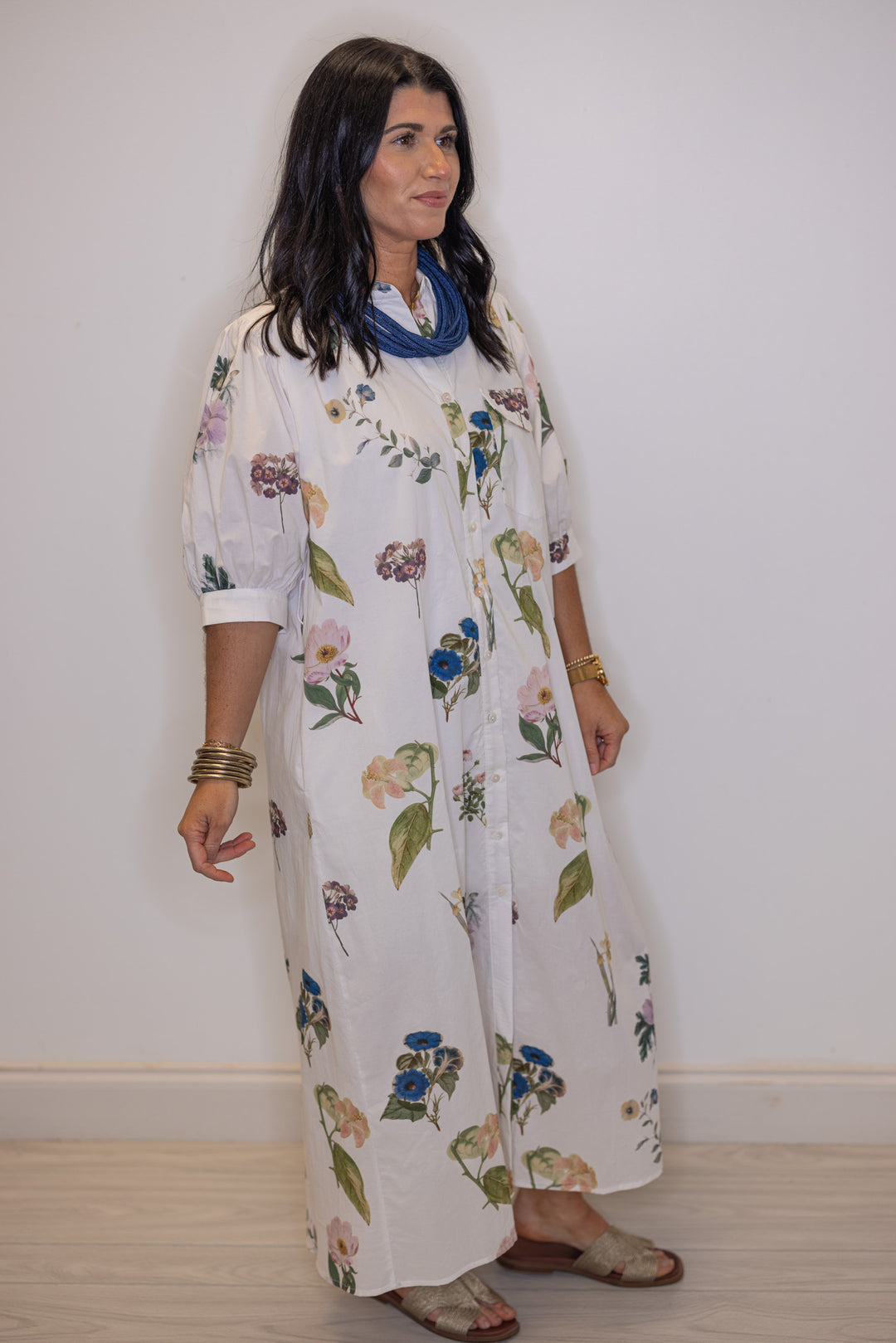 Women's off white floral print button front midi dress with belted waist by Entro showing short puff sleeves