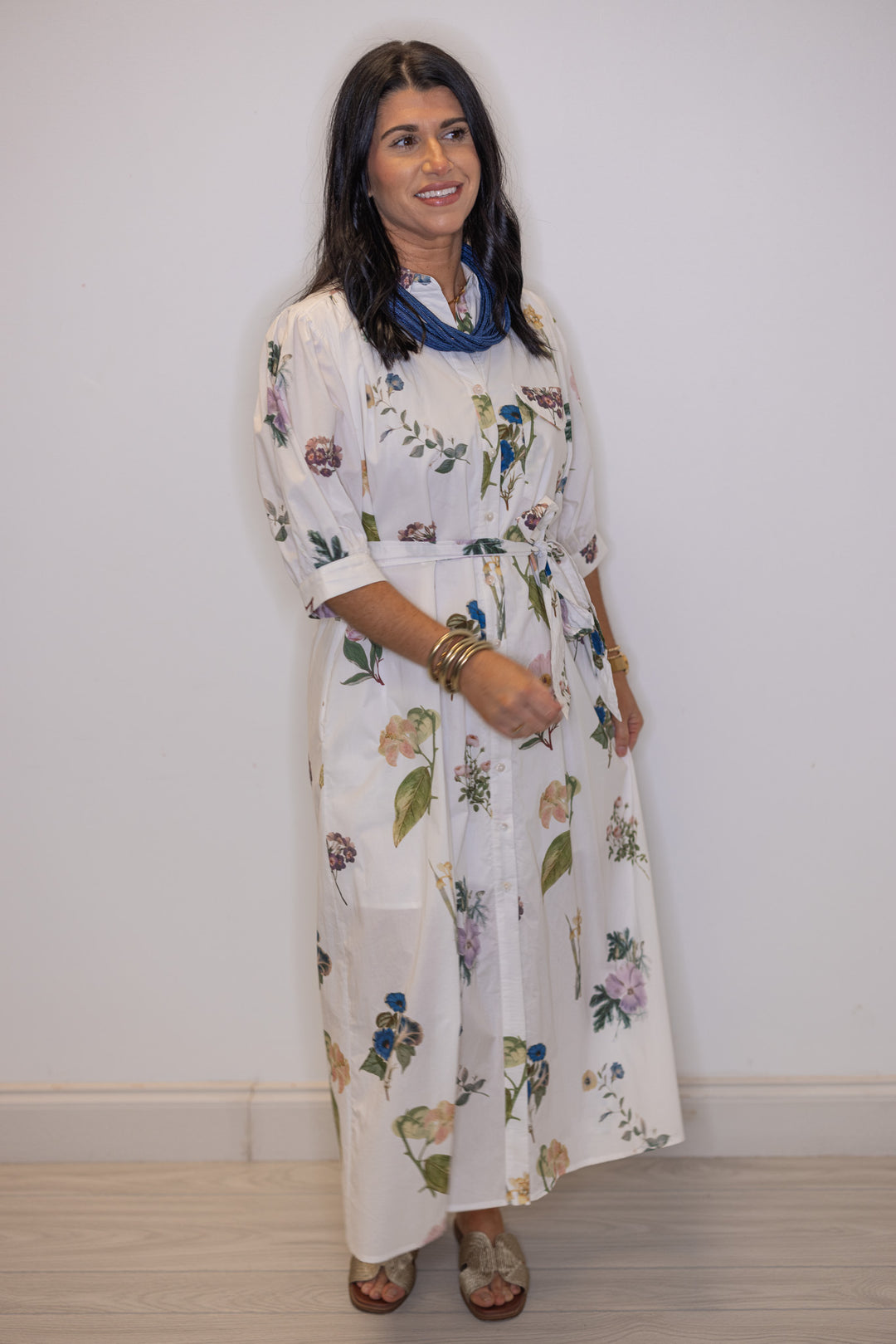 Women's off white floral print button front midi dress with belted waist by Entro, perfect for church