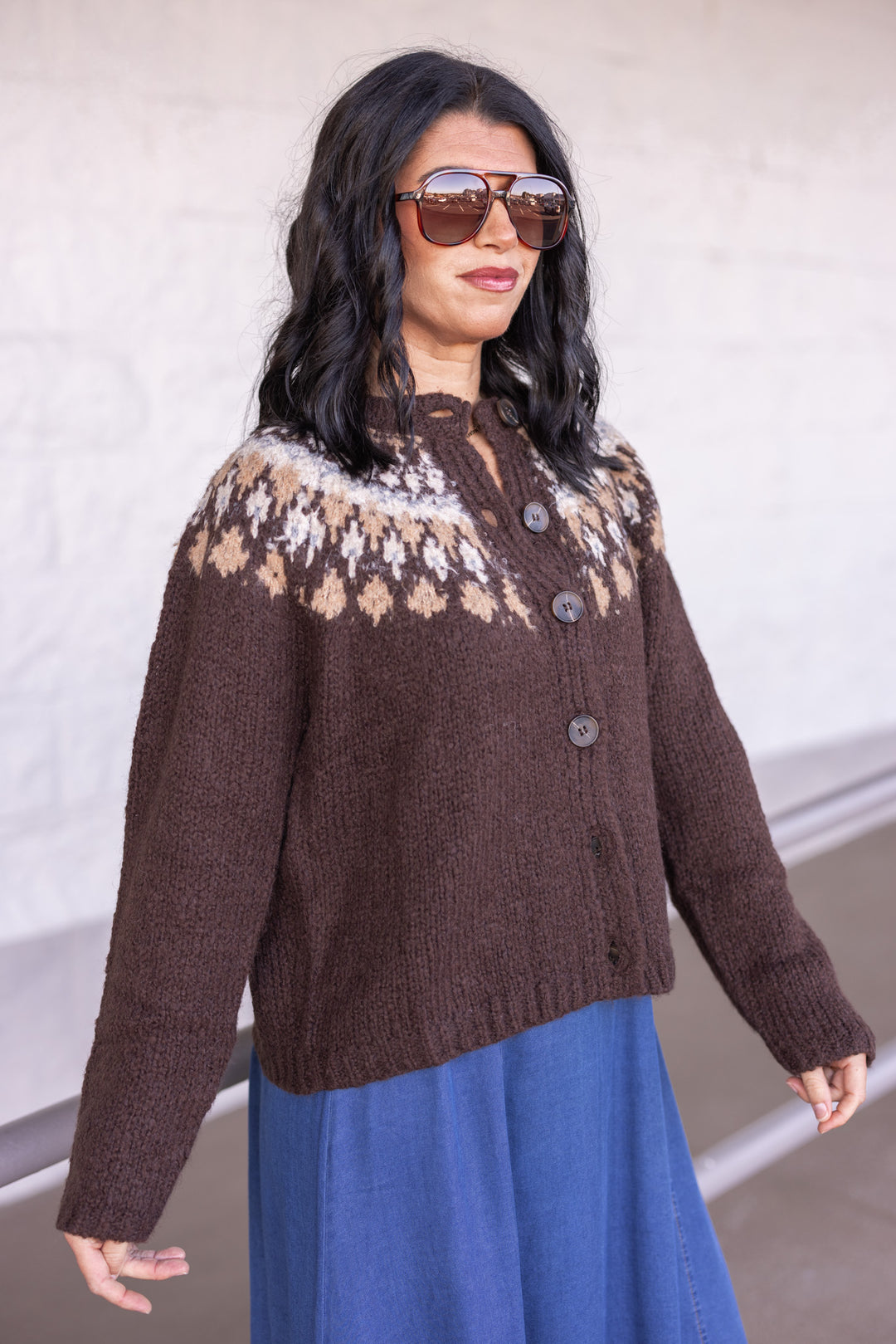 Women's brown button front sweater cardigan with print around the shoulders by Blu Pepper showing slight side view