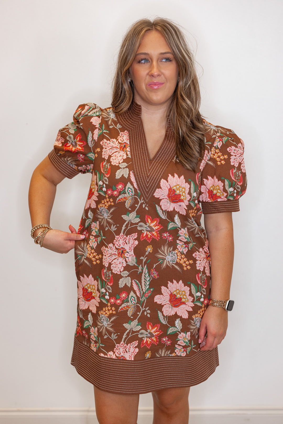 Women's brown multicolor floral print dress with stitching trim detail by Entro showing true to size fit