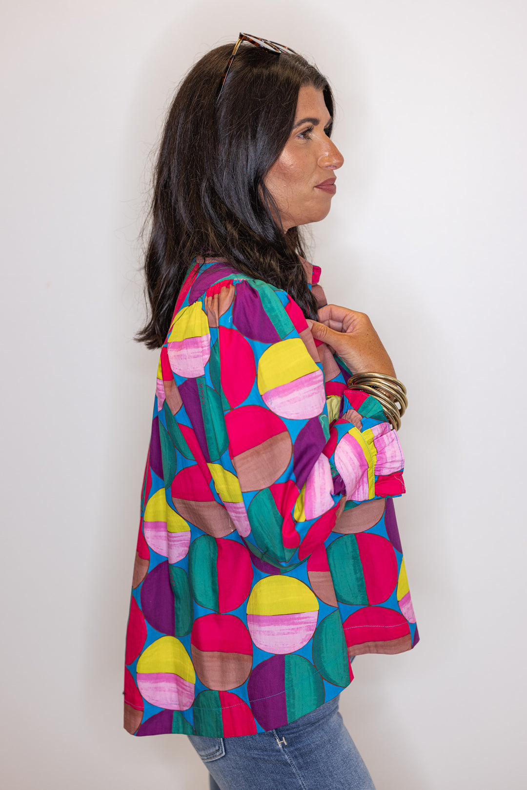 Women's hot pink and multicolor print button front poplin top by Karlie showing side view