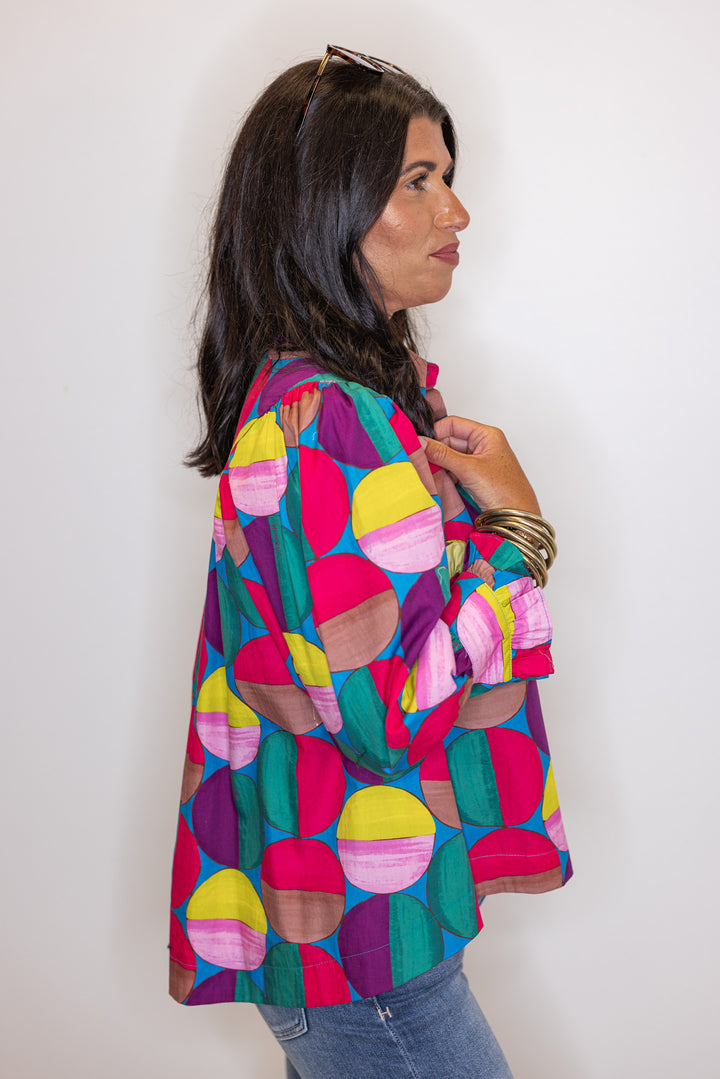 Women's hot pink and multicolor print button front poplin top by Karlie showing side view