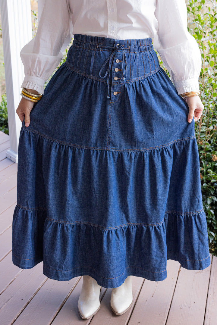 Dark denim maxi skirt by Peach Love California showing tiered style design
