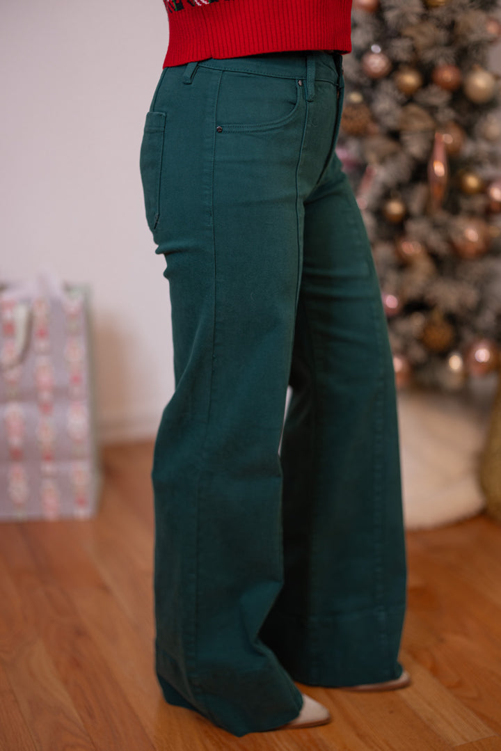Risen Jeans hunter green tummy control mid rise wide leg jeans showing side view