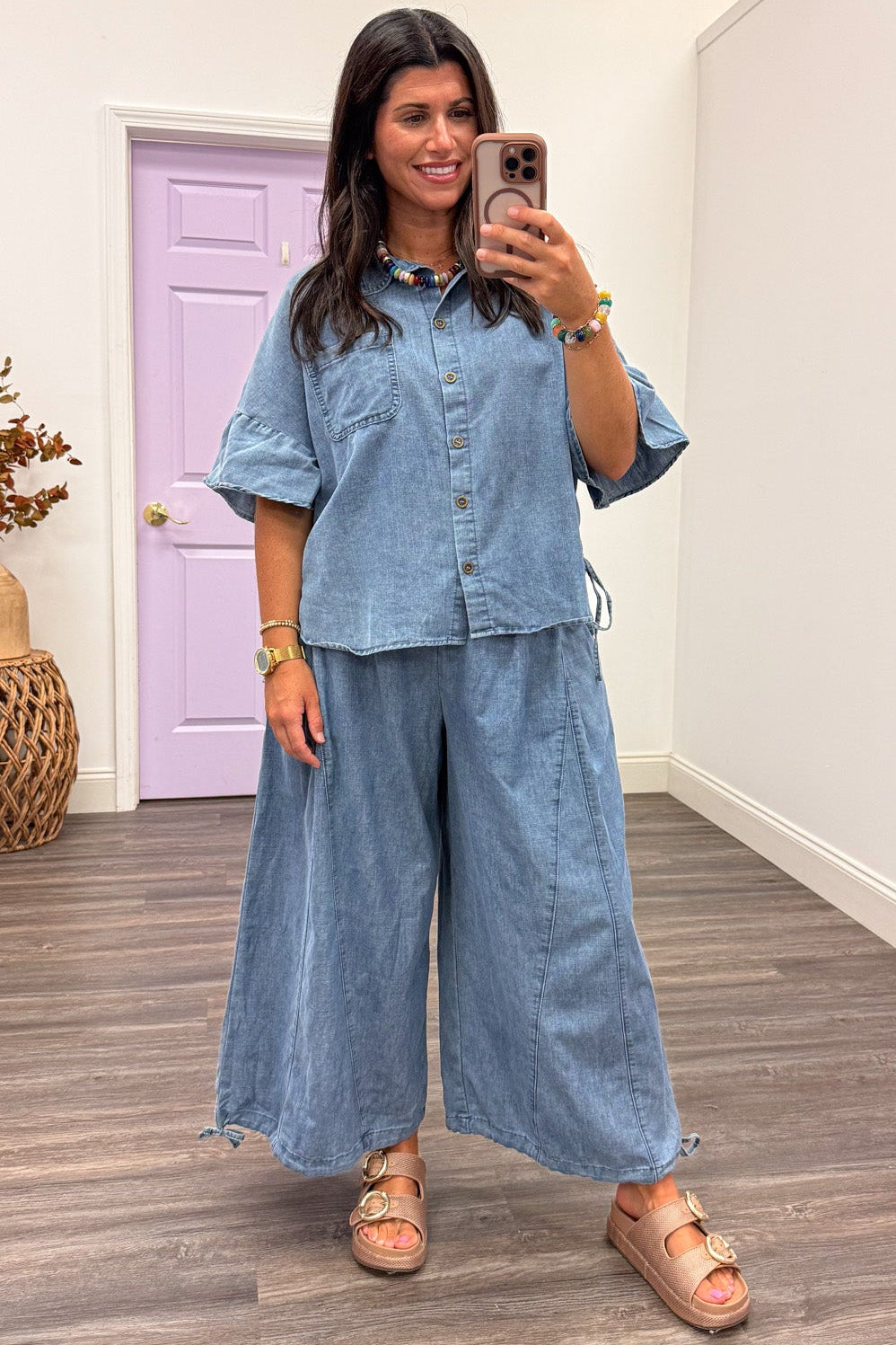washed blue lightweight denim button front short sleeve top with cinch drawstring sides