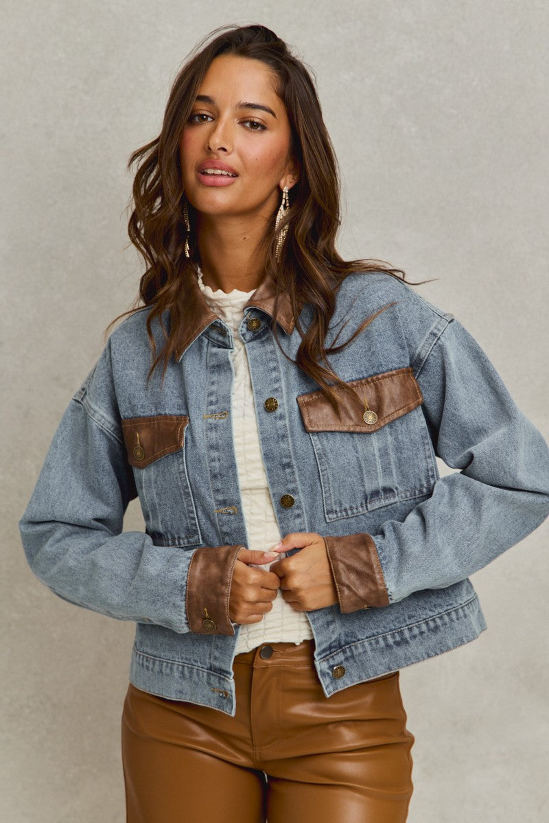 denim jacket with brown leather trim details