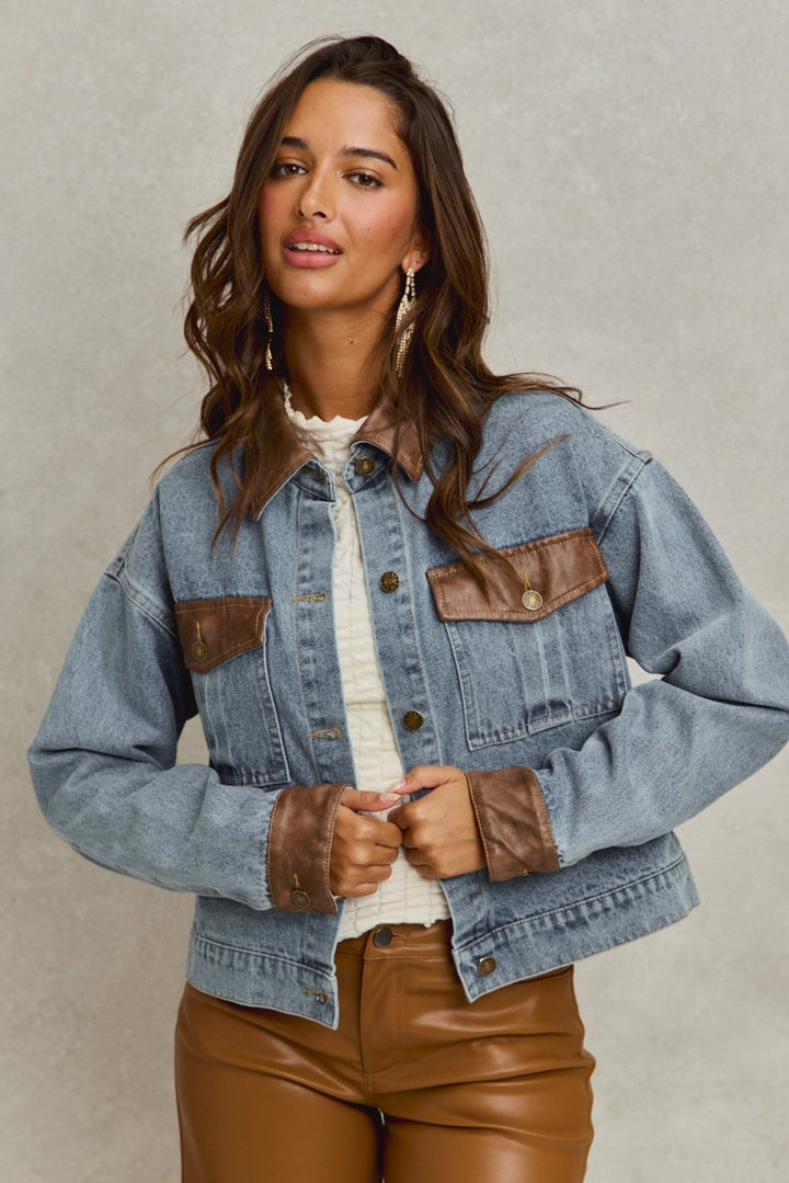 denim jacket with brown leather trim details