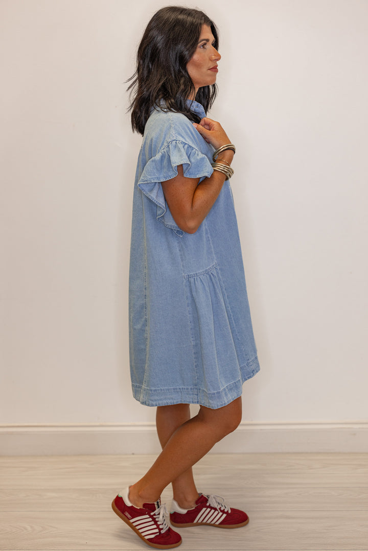Women's light blue denim button down swing dress by Entro showing full side view