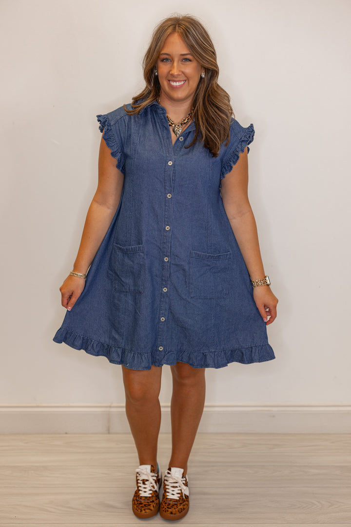 Dark blue denim button down dress with ruffle details by Entro showing full front view