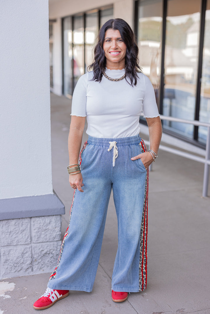 Women's ivory ribbed top with lettuce trim by Polygram showing full front view