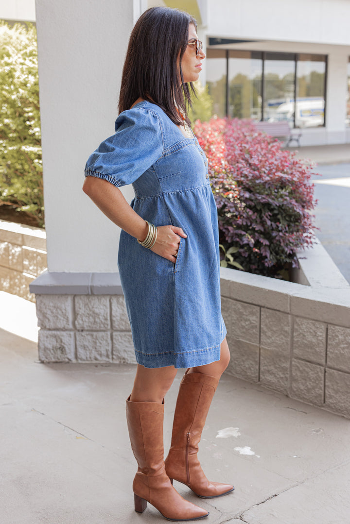 Women's denim puff sleeve dress with button front bodice by Wishlist showing full side view