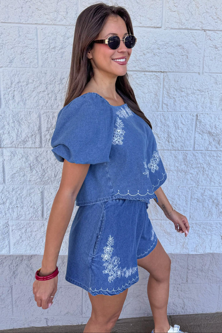 medium washed blue denim white floral embroidery short sleeve top