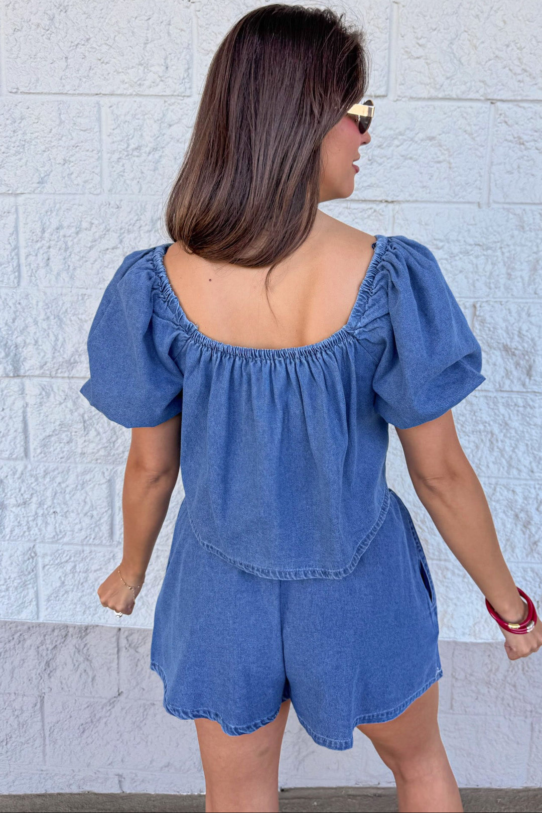 medium washed blue denim white floral embroidery elastic back neckline top