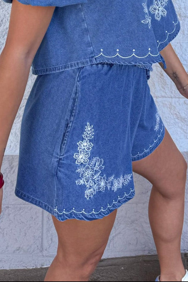 medium washed blue denim with white embroidery front pocket shorts