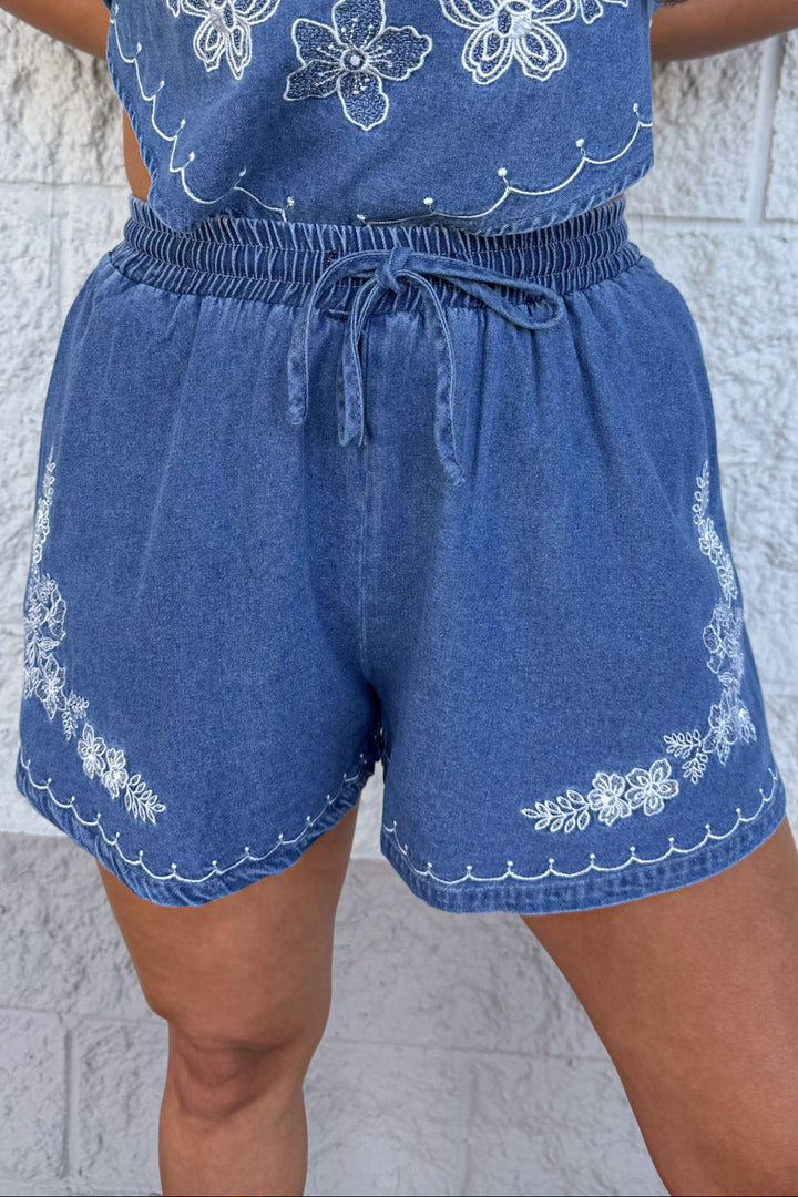 medium washed blue denim with white embroidery wide leg shorts