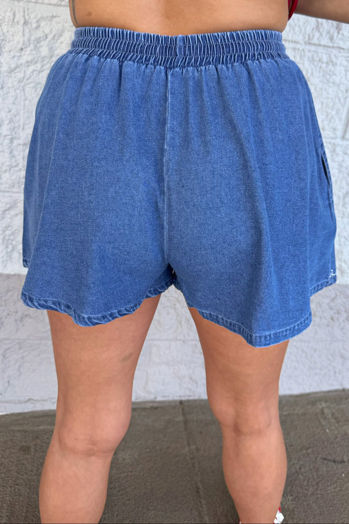 medium washed blue denim with white embroidery elastic waistband shorts