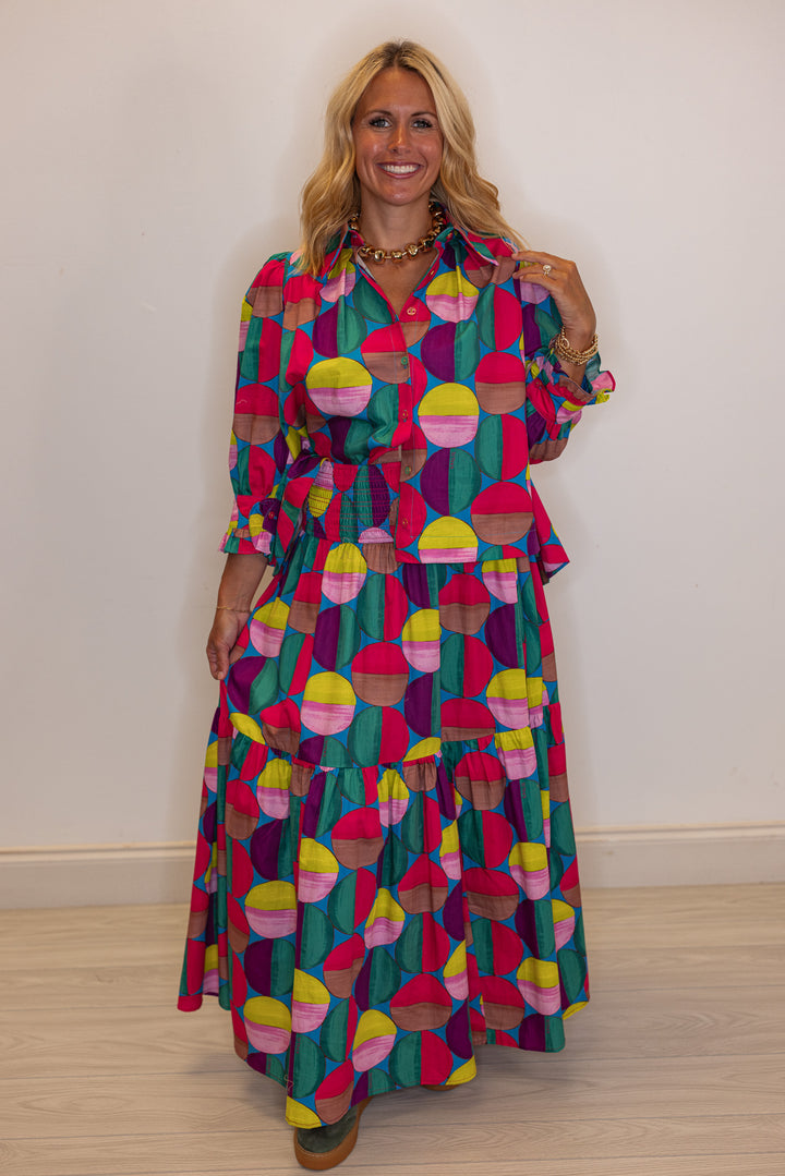 Women's hot pink and multicolor print button front poplin top by Karlie shown with matching skirt