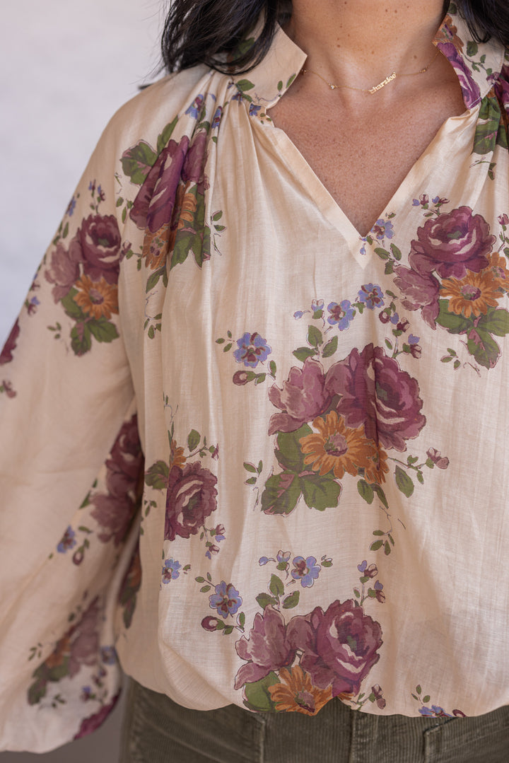 Women's ecru bubble hem top with large burgundy and olive floral print by Entro showing close look at floral print