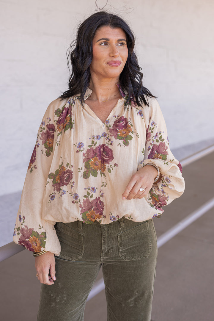 Women's ecru bubble hem top with large burgundy and olive floral print by Entro