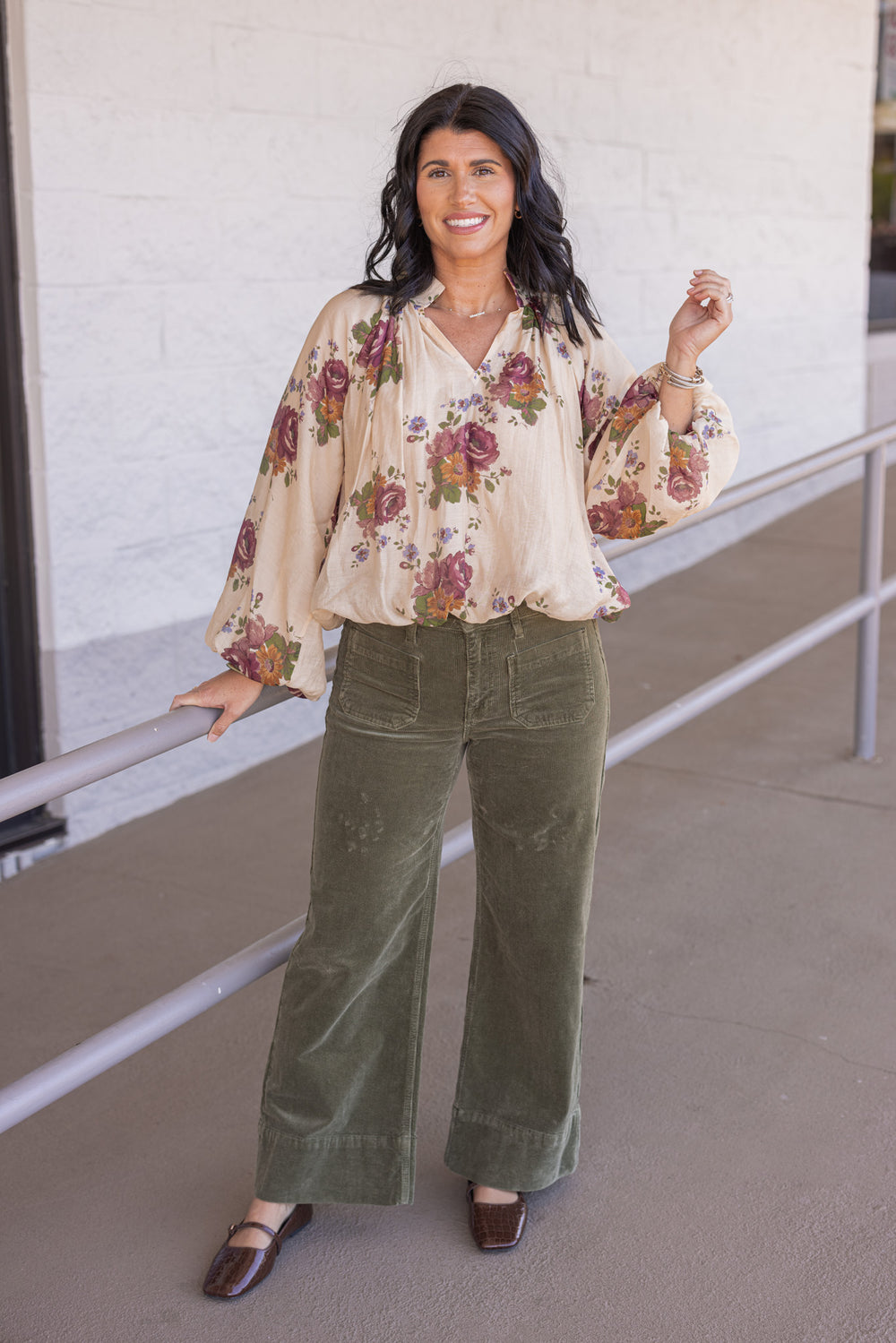 Women's ecru bubble hem top with large burgundy and olive floral print by Entro showing full front view