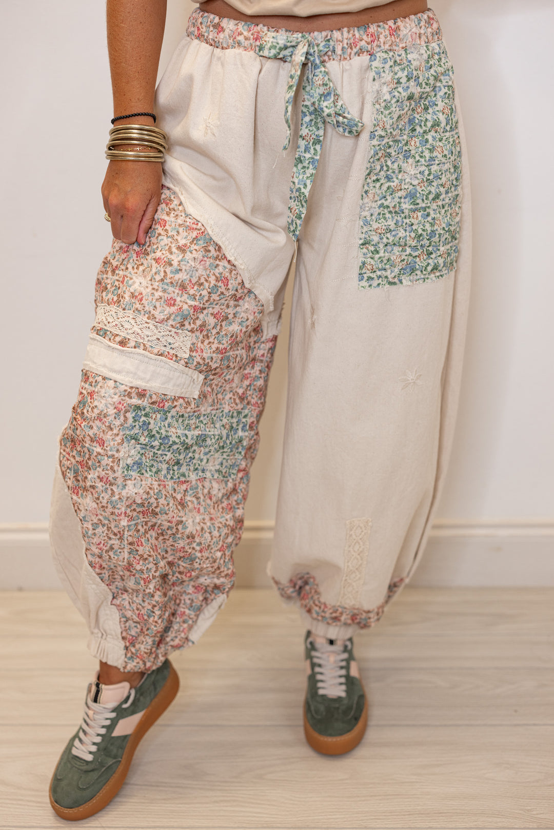 Women's oatmeal twill wide leg jogger pants with multicolor floral patches by POL showing up close front view