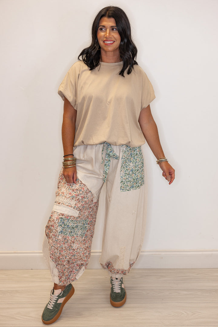 Women's oatmeal twill wide leg jogger pants by POL showing multicolor floral patches