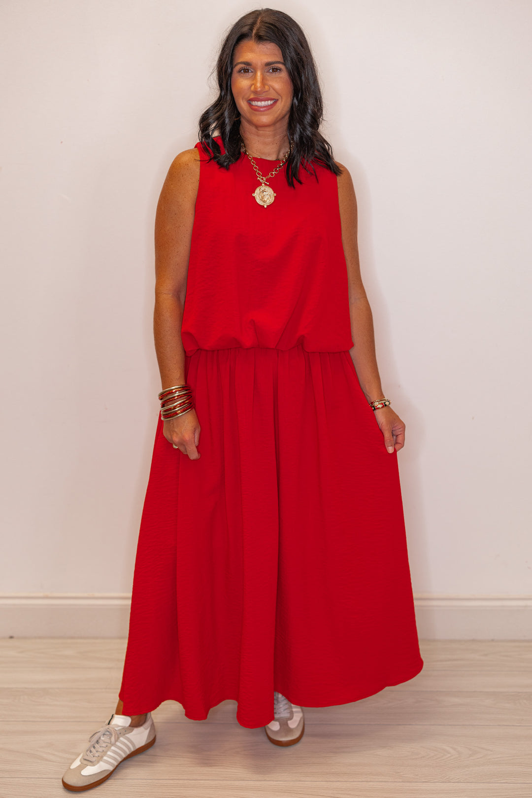 Women's red textured bubble hem sleeveless crop top by Entro showing full front view