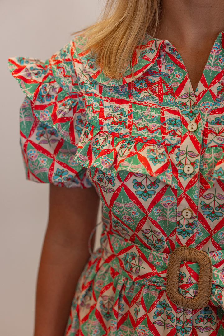 Women's green and coral pink floral print belted poplin maxi dress by Karlie showing up close view of floral pattern