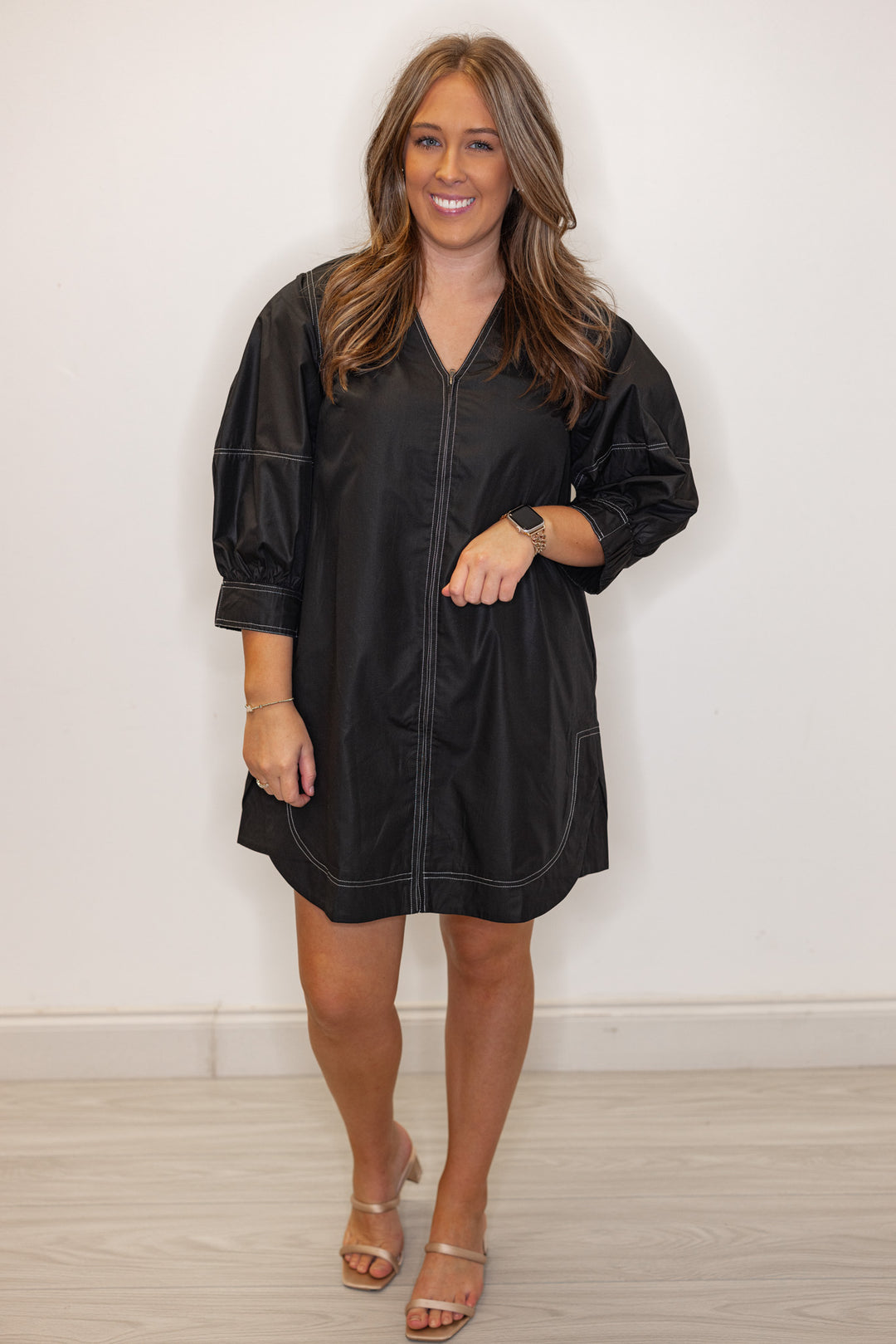 Women's trendy black mini dress with cream contrasting stitching throughout by Entro