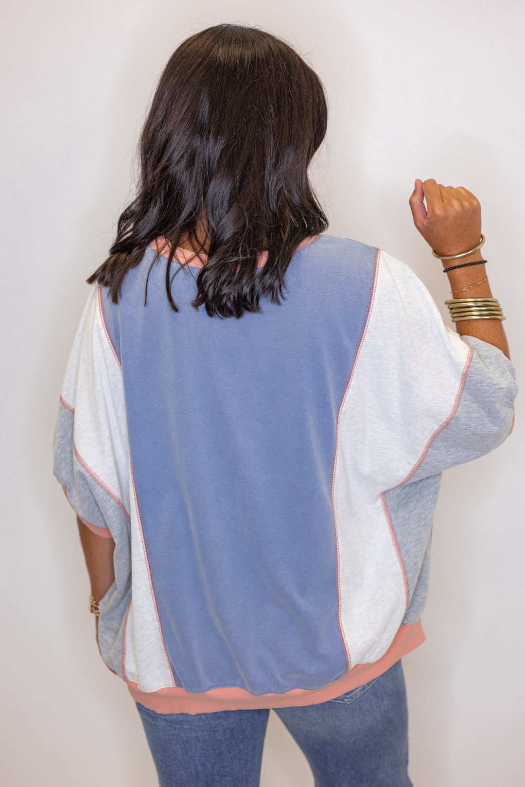 Women's washed french terry knit colorblock top in blue, grey and coral by Easel showing back view