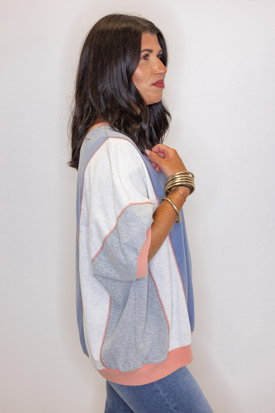 Women's washed french terry knit colorblock top in blue, grey and coral by Easel showing side view