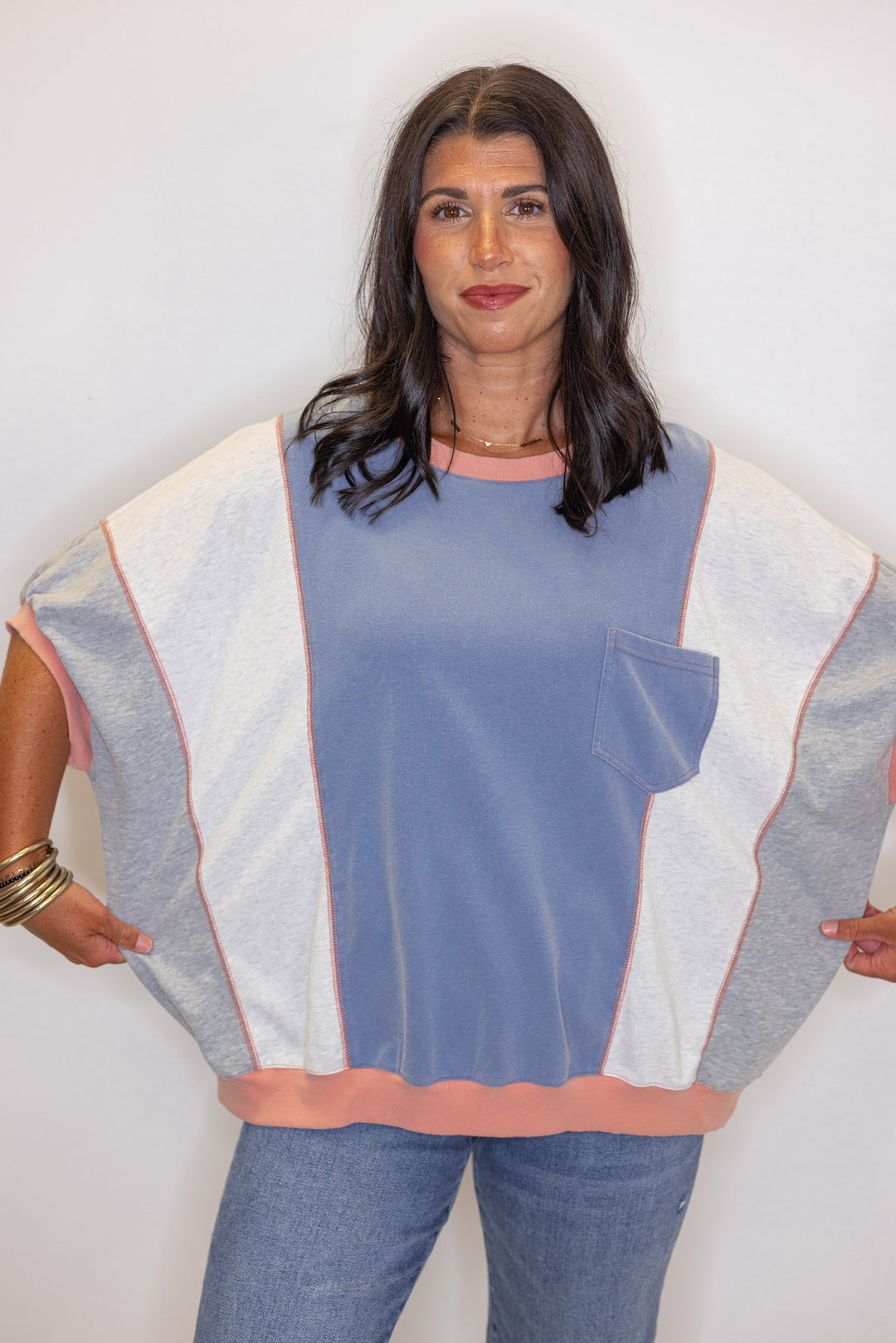 Women's washed french terry knit colorblock top in blue, grey and coral by Easel showing relaxed fit