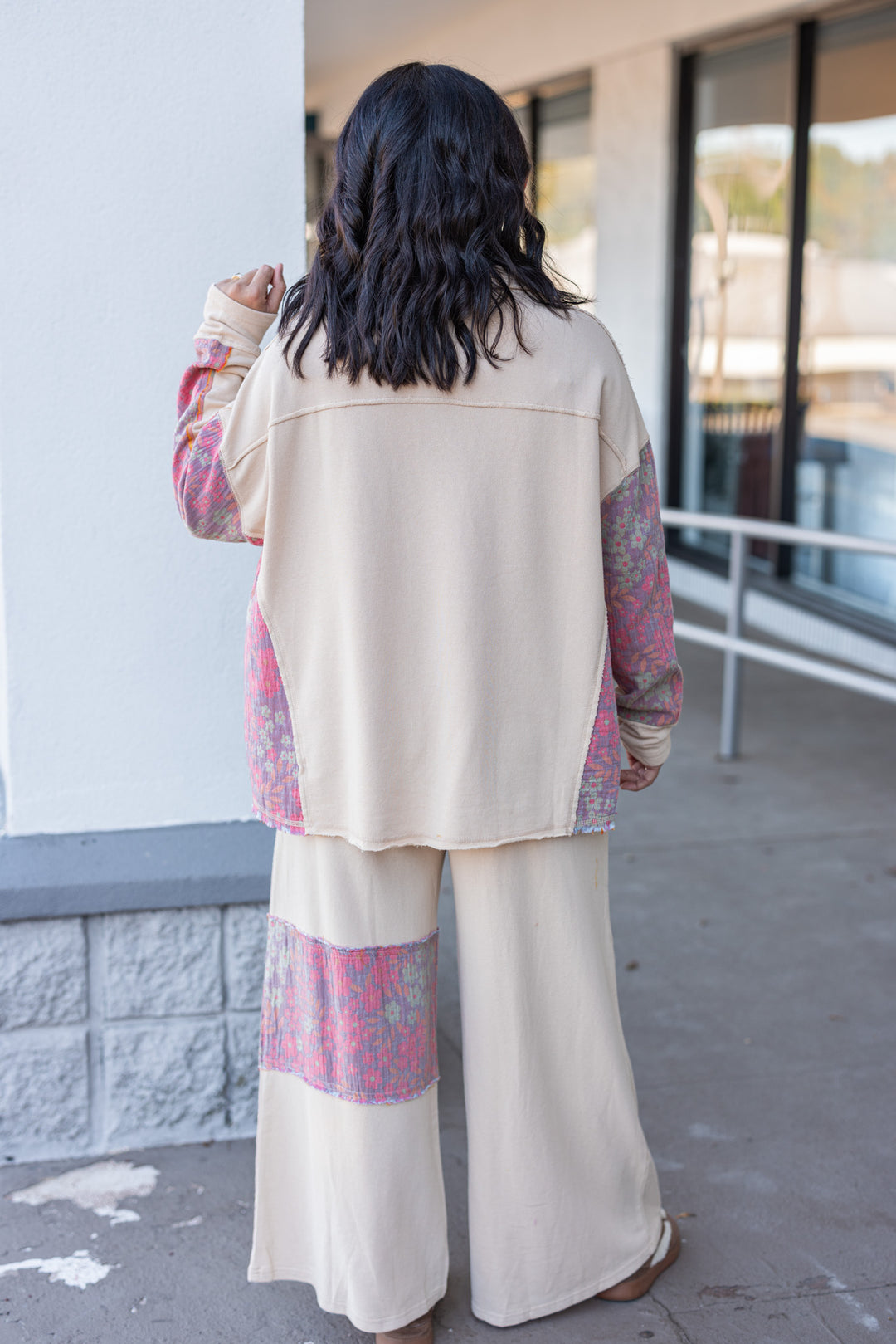 Women's french terry knit oatmeal pants with frayed floral patch gauze details by Easel showing full back view