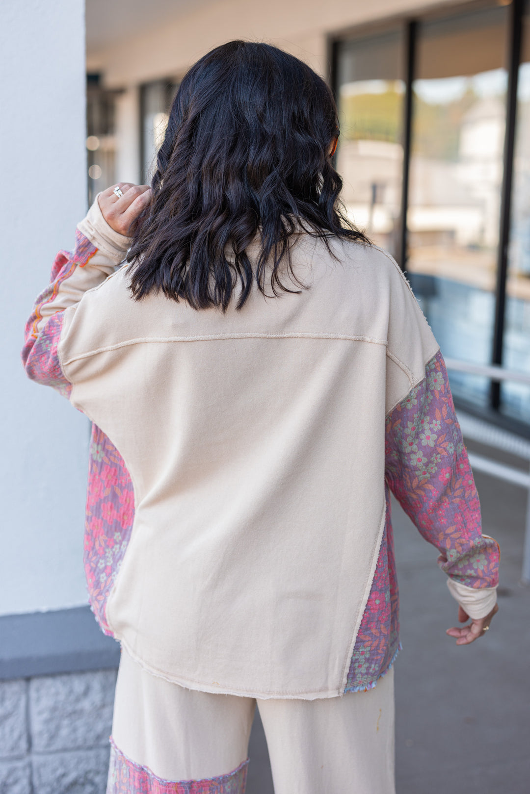 Women's french terry knit oatmeal pullover top with frayed floral patch gauze details by Easel showing back view