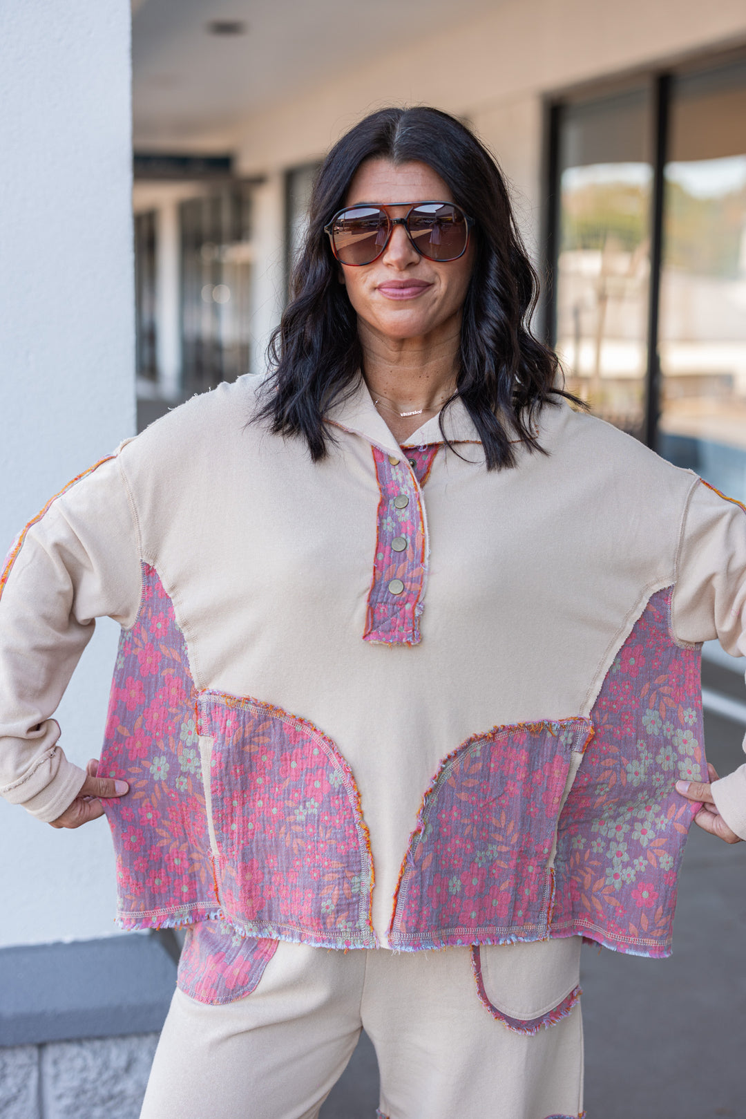 Women's french terry knit oatmeal pullover top with frayed floral patch gauze details by Easel showing relaxed silouhette