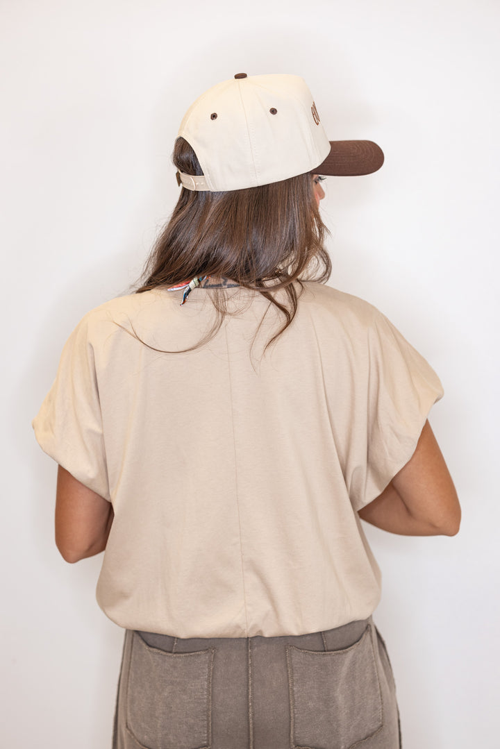 Women's sand knit semi-cropped top with bubble hem by Wishlist showing up close back view