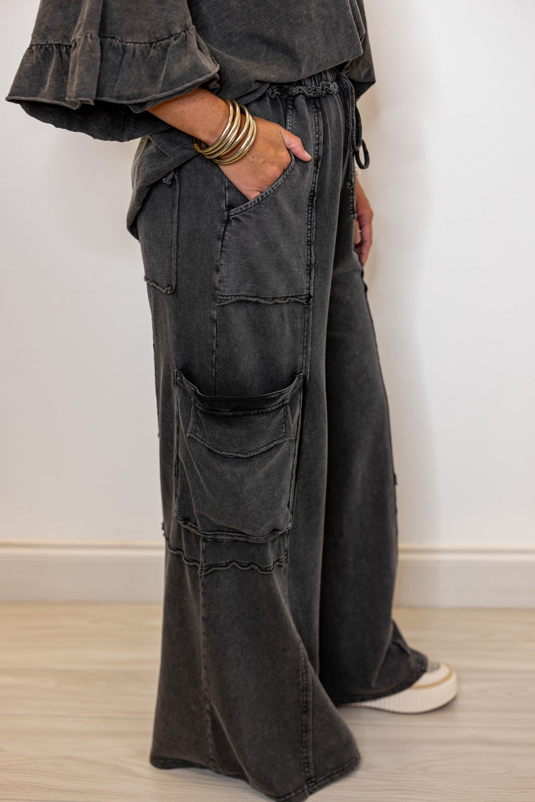 Women's mineral washed black terry knit exaggerated wide leg pants by Easel showing up close side view