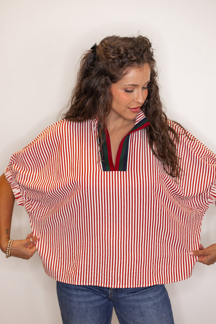 Women's brick red striped short sleeve top showing the fit detail