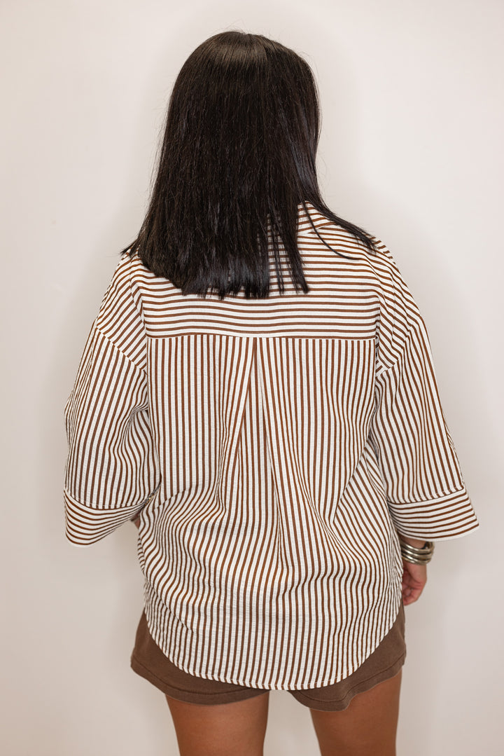 back view of Women's brown and ivory striped 3/4 sleeve blouse