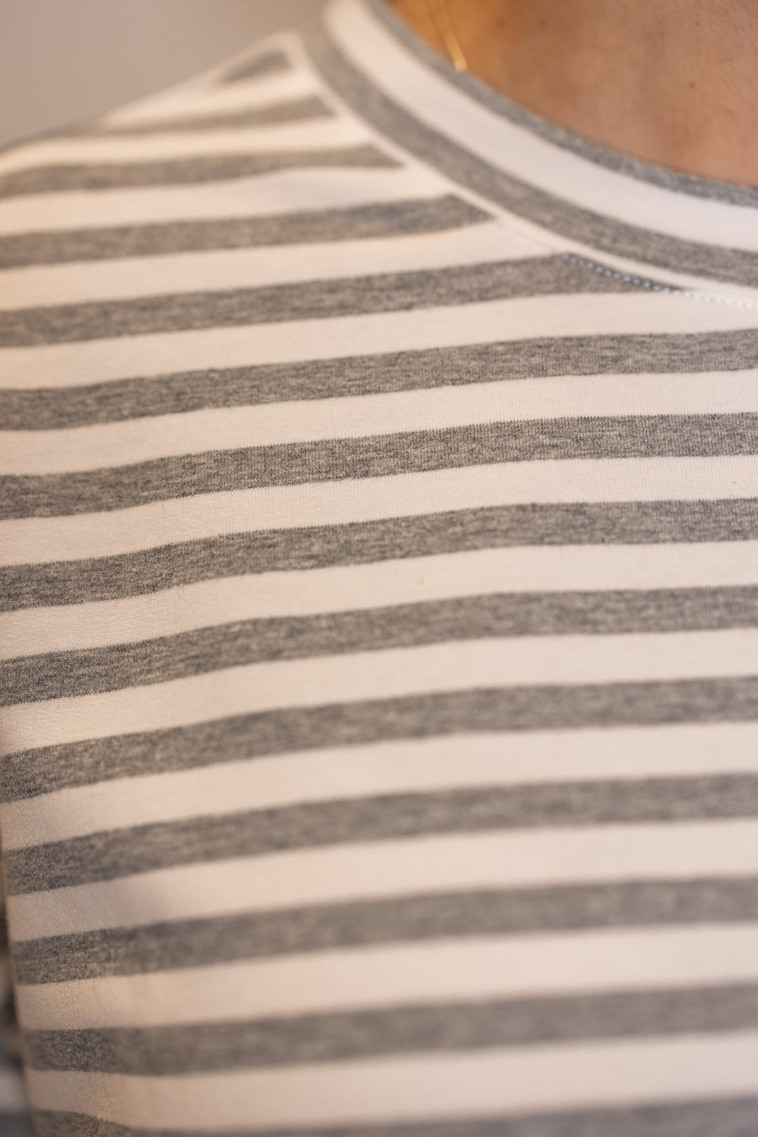 Women's grey lounge top showing striped pattern