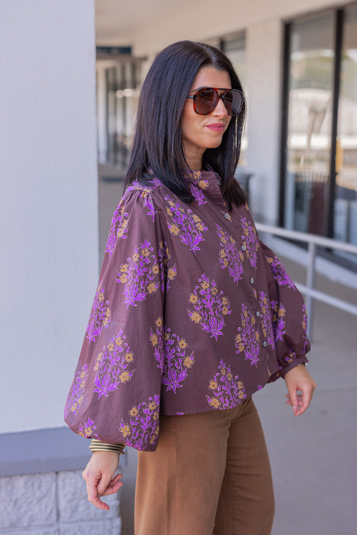 Women's chocolate brown button front poplin top with orange and purple florals by Entro showing side view