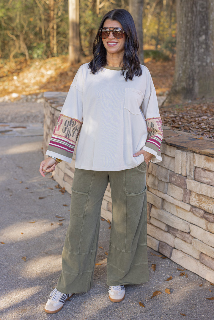 Women's washed ecru knit top with striped trim and floral details at the sleeves by Easel, perfect for teachers
