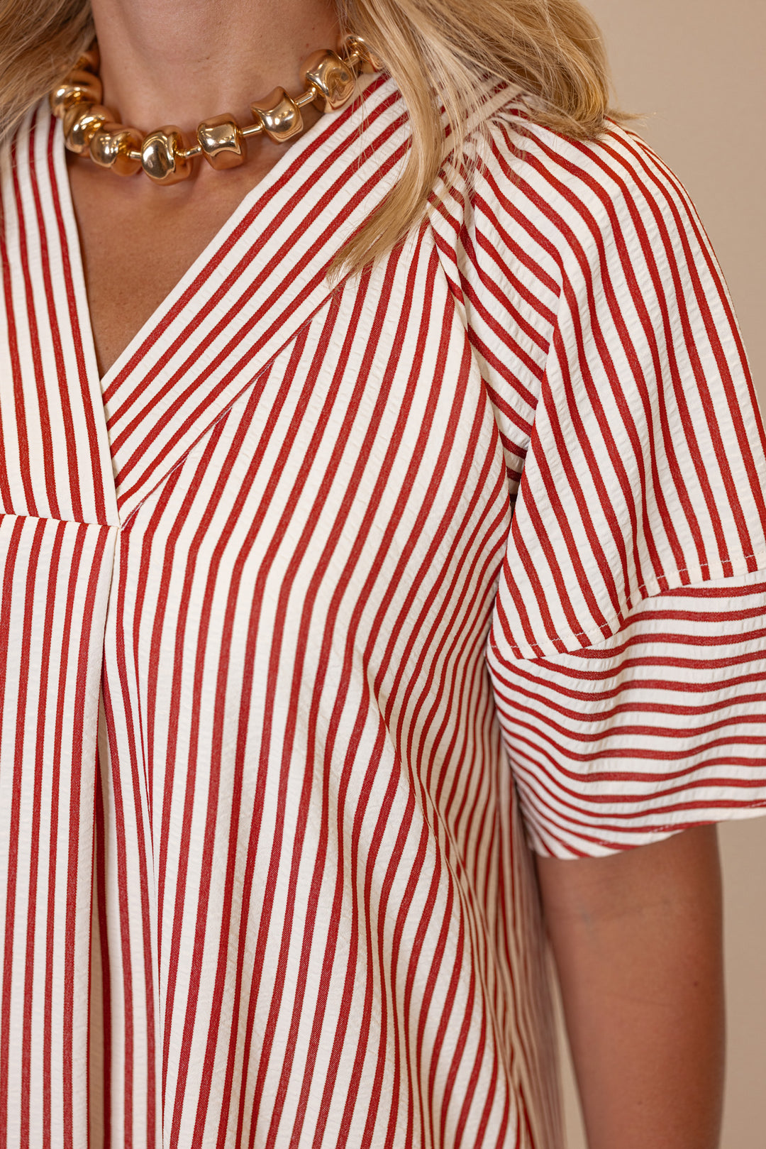 Women's rust and ivory striped midi dress by Entro showing striped print detail 