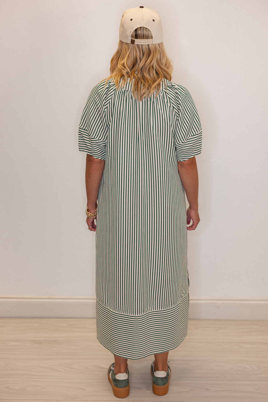 Women's hunter green and ivory striped midi dress by Entro showing back view