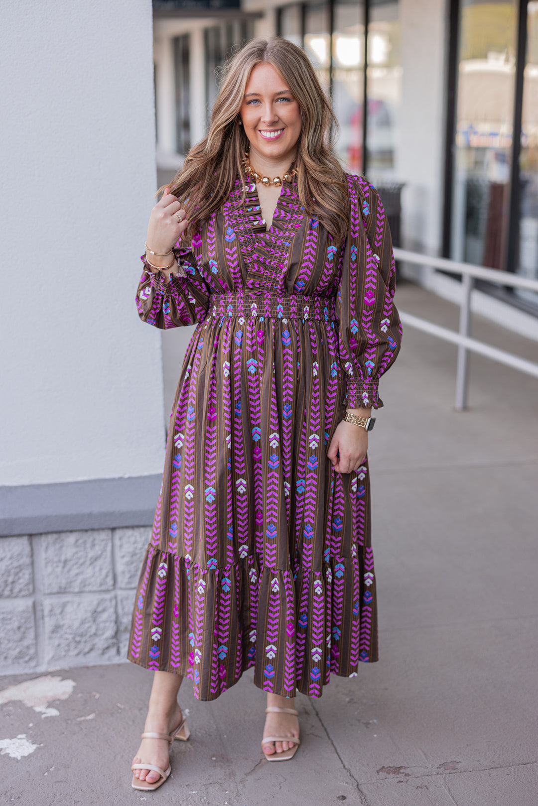 Women's brown ruffle trimmed midi dress with pink multicolor petal print by Umgee showing full front view