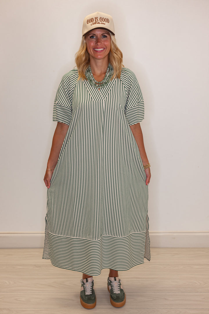Women's hunter green and ivory striped midi dress by Entro showing relaxed fit