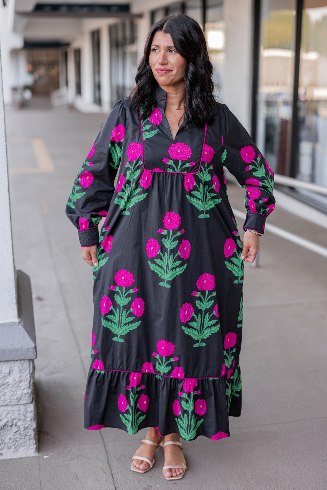 Women's black midi dress with hot pink floral print and hot pink piping trim by Jodifl showing relaxed silouhette