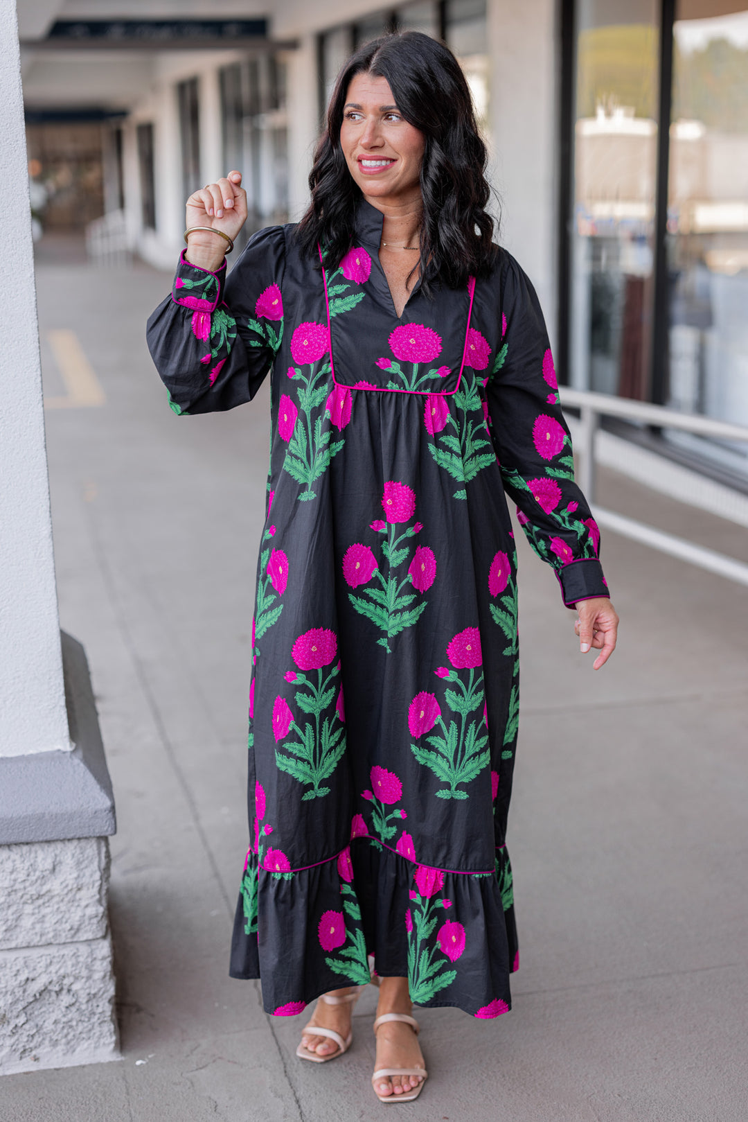 Women's black midi dress with hot pink floral print and hot pink piping trim by Jodifl showing full front view